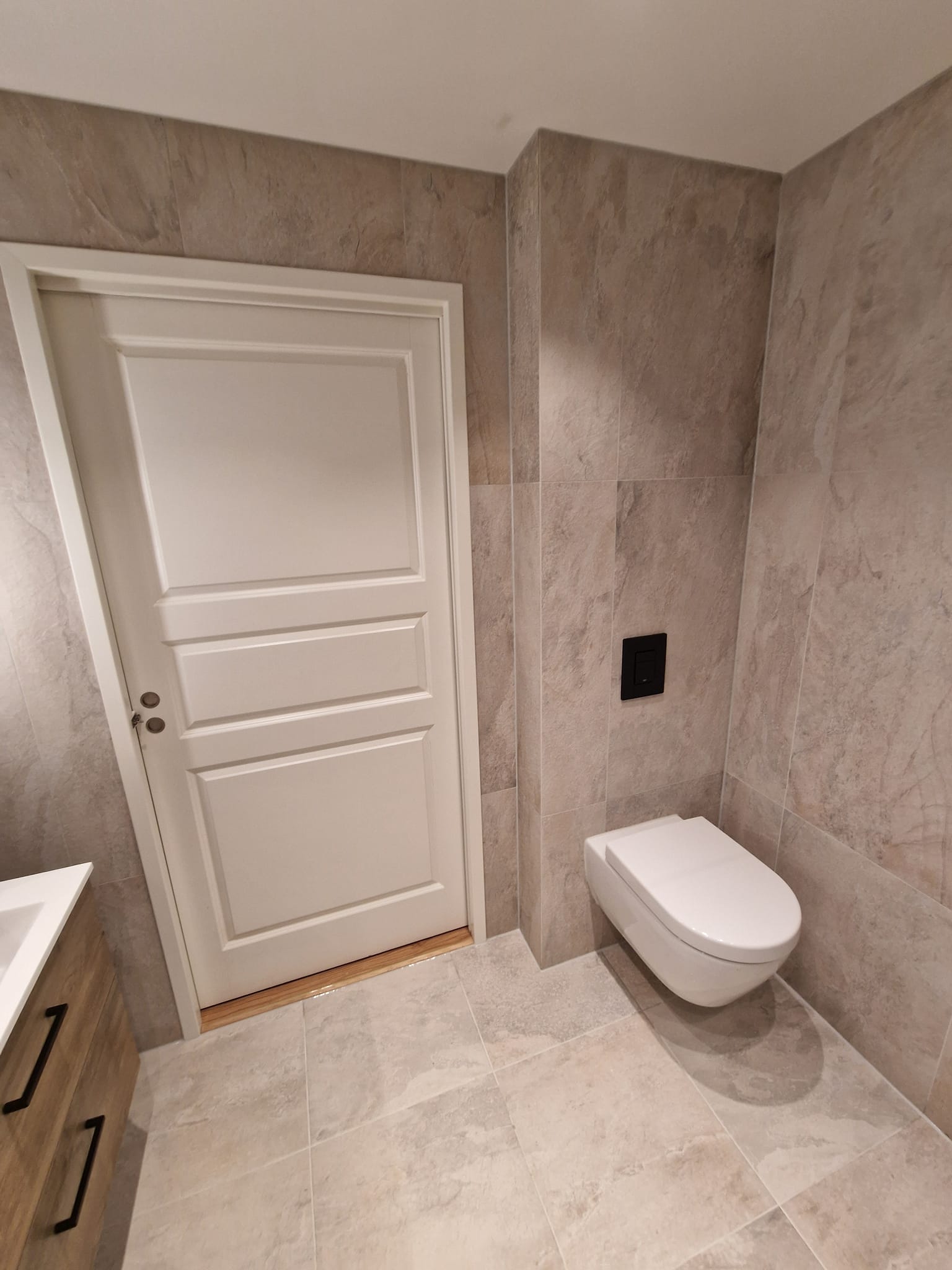 Light bathroom with shower and sink